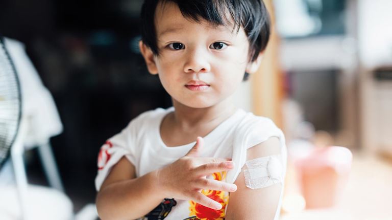 Little boy with bandaid